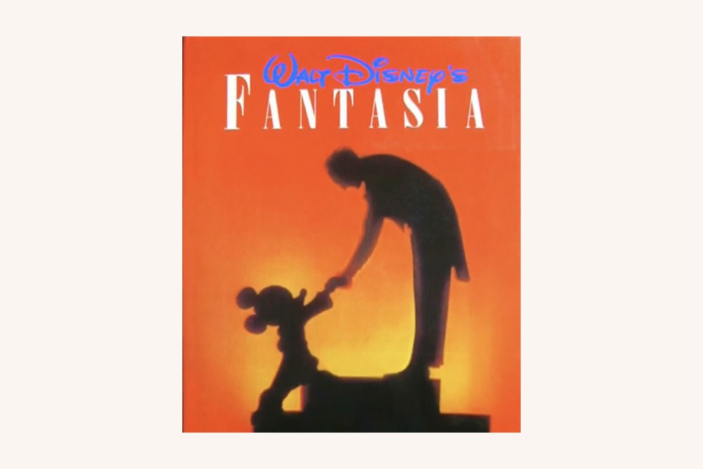 Leopold Stokowski shaking hands with Mickey Mouse in the 1940 animated film, Fantasia