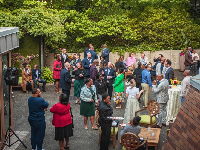 Patrons convening in the Mann&#039;s Cadillac Terrace before a performance