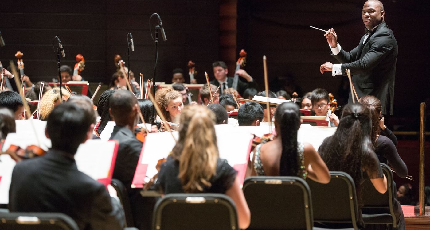 Joseph Conyers directing All City Orchestra